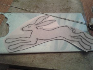 Hare design ready to pierce out from the silver sheet
