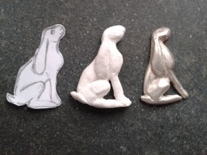 The 3 stages of the silver hare - from sketch, to Fimo model, to silver casting