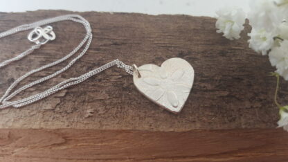 Flowery silver heart pendant
