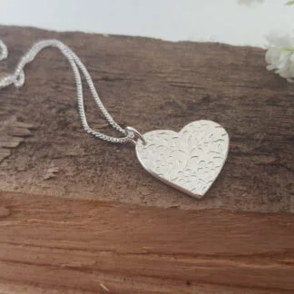 Floral pattern silver heart pendant