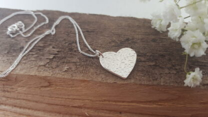 Floral pattern silver heart pendant
