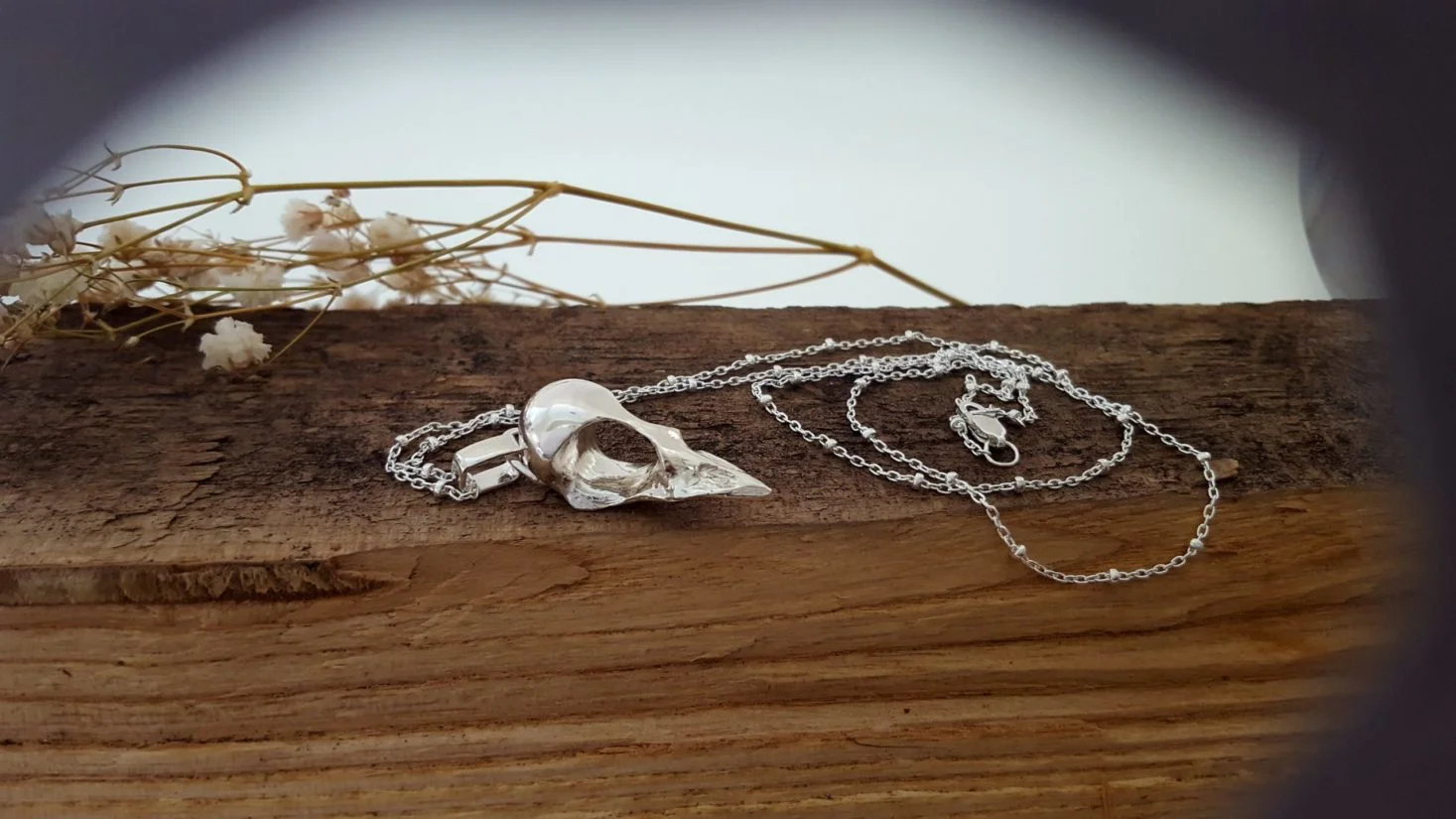 Silver bird skull pendant