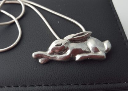 Sleeping silver hare pendant on a chain